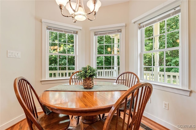 6125 Trinity Church Rd, Dinwiddie, VA 23833 - dining room featuring a chandelier and light wood-type flooring
