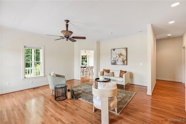 6125 Trinity Church Rd, Dinwiddie, VA 23833 - living room featuring crown molding, a chandelier, ceiling fan, light wood-type flooring, and recessed lighting