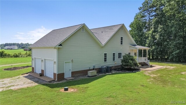 6125 Trinity Church Rd, Dinwiddie, VA 23833 - view of side of property featuring a yard, a garage, and a shingled roof