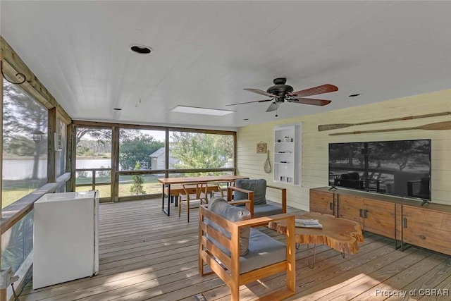 186 Bay Shore Point Rd, Port Haywood, VA 23138 - sunroom with hardwood / wood-style flooring, a wooden deck, wooden walls, and a skylight