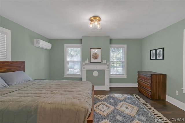 186 Bay Shore Point Rd, Port Haywood, VA 23138 - bedroom featuring a wall mounted AC and wood finished floors