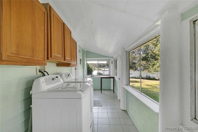 186 Bay Shore Point Rd, Port Haywood, VA 23138 - washroom with cabinet space, separate washer and dryer, light tile patterned floors, and a water view