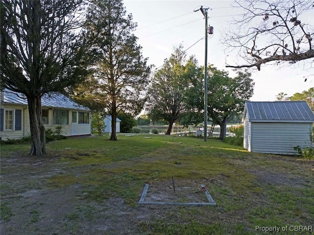 186 Bay Shore Point Rd, Port Haywood, VA 23138 - view of green lawn featuring a shed