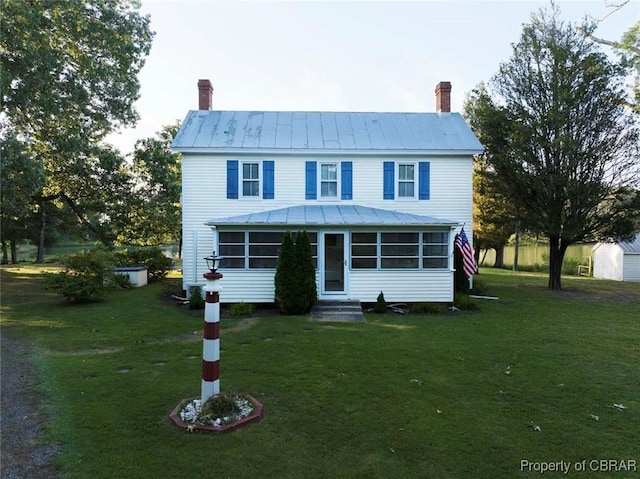 186 Bay Shore Point Rd, Port Haywood, VA 23138 - view of front facade with a chimney, entry steps, a standing seam roof, and a front yard