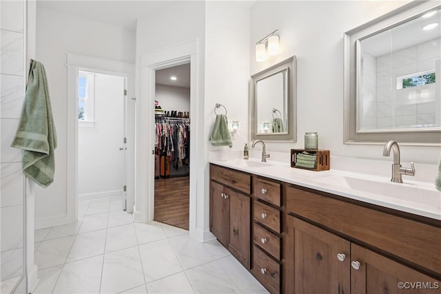 9524 Simonsville Rd, Midlothian, VA 23112 - full bathroom with double vanity, healthy amount of natural light, and marble look tile flooring