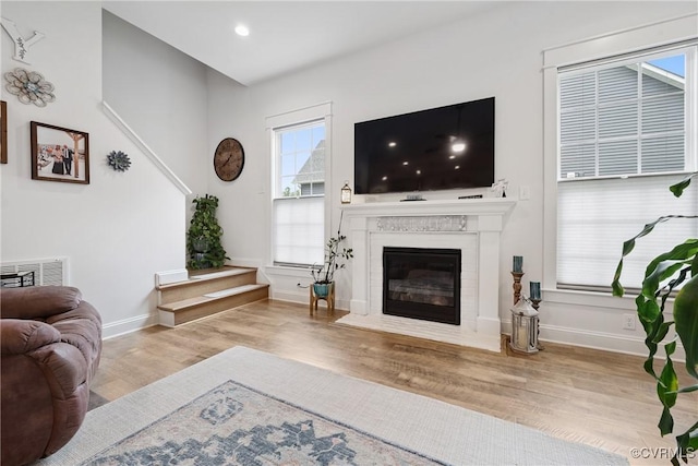 9524 Simonsville Rd, Midlothian, VA 23112 - living room with wood finished floors, plenty of natural light, a fireplace with flush hearth, and recessed lighting