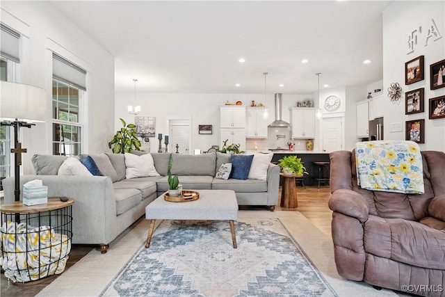 9524 Simonsville Rd, Midlothian, VA 23112 - living room featuring light wood-style flooring, a chandelier, and recessed lighting