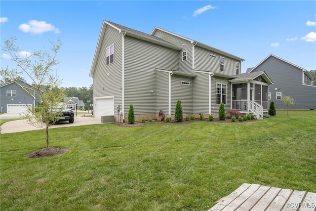9524 Simonsville Rd, Midlothian, VA 23112 - rear view of property with an attached garage, a sunroom, concrete driveway, and a yard