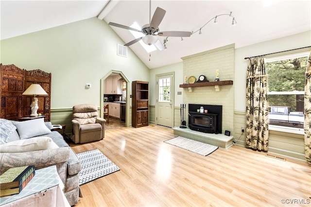 4310 Courthouse Rd, Prince George, VA 23875 - living area featuring light wood finished floors, beamed ceiling, ceiling fan, arched walkways, and high vaulted ceiling