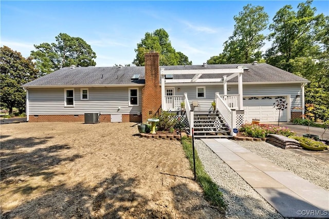 4310 Courthouse Rd, Prince George, VA 23875 - back of house featuring a garage, crawl space, a chimney, a deck, and concrete driveway