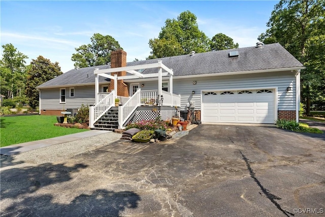 4310 Courthouse Rd, Prince George, VA 23875 - ranch-style house featuring asphalt driveway, a chimney, a front yard, a garage, and brick siding