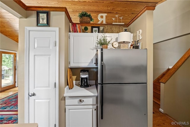 275 Meadowview Ln, Farmville, VA 23901 - kitchen featuring freestanding refrigerator, wooden ceiling, white cabinetry, light countertops, and wood finished floors