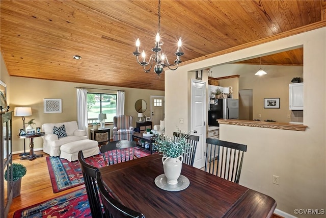 275 Meadowview Ln, Farmville, VA 23901 - dining area featuring wooden ceiling, a chandelier, vaulted ceiling, and light wood-style flooring