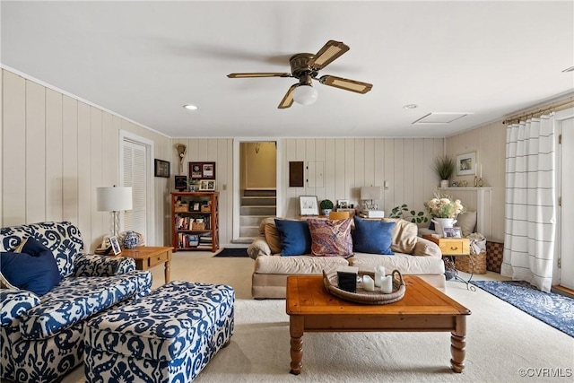 275 Meadowview Ln, Farmville, VA 23901 - carpeted living room featuring ceiling fan, ornamental molding, wooden walls, and stairway