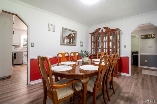 12001 Buckhorn Rd, Chesterfield, VA 23838 - dining room with arched walkways, wood finished floors, crown molding, and a textured ceiling