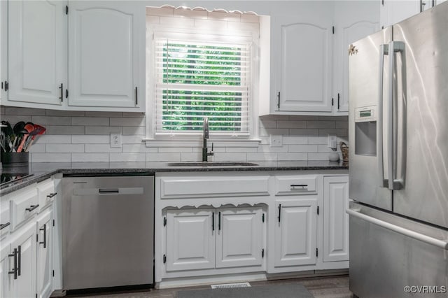 12001 Buckhorn Rd, Chesterfield, VA 23838 - kitchen featuring stainless steel appliances, white cabinets, backsplash, and dark stone counters