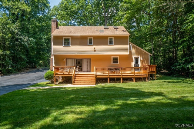 12001 Buckhorn Rd, Chesterfield, VA 23838 - back of house featuring a chimney, a deck, a yard, and driveway