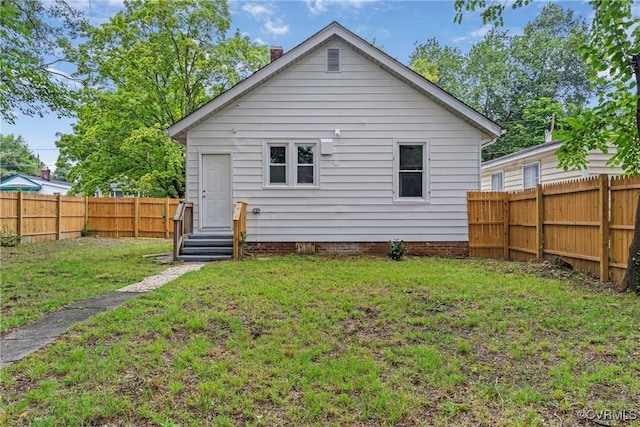 3406 Lawson St, Richmond, VA 23224 - rear view of property with a fenced backyard and a chimney