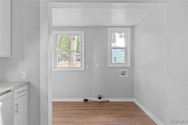 3406 Lawson St, Richmond, VA 23224 - washroom with plenty of natural light, hookup for a washing machine, and wood finished floors