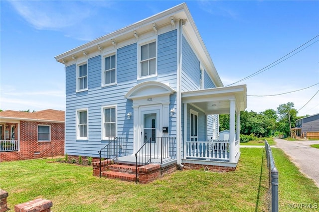 521 S Sycamore St, Petersburg, VA 23803 - italianate-style house featuring a porch and a front lawn