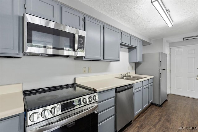 7604 Roscommon Ct Unit 2403, Henrico, VA 23228 - kitchen featuring appliances with stainless steel finishes, a textured ceiling, dark wood-type flooring, light countertops, and gray cabinets