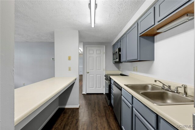 7604 Roscommon Ct Unit 2403, Henrico, VA 23228 - kitchen with stainless steel appliances, dark wood finished floors, a textured ceiling, and light countertops
