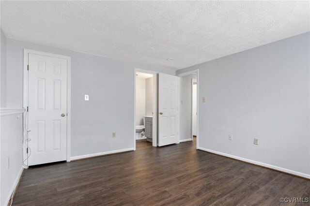 7604 Roscommon Ct Unit 2403, Henrico, VA 23228 - unfurnished bedroom with dark wood-style flooring, a textured ceiling, and ensuite bathroom