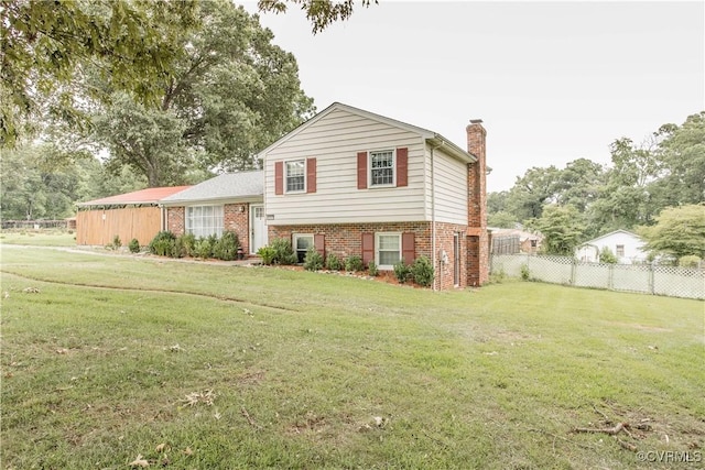 15601 Meridian Ave, Chester, VA 23831 - tri-level home featuring a chimney and brick siding