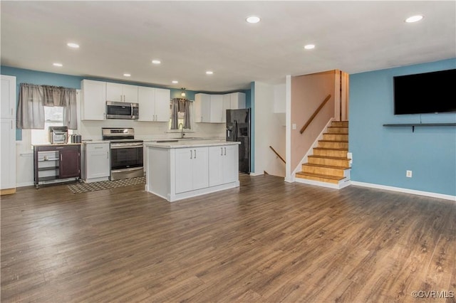 15601 Meridian Ave, Chester, VA 23831 - kitchen featuring stainless steel appliances, open floor plan, light countertops, white cabinets, and recessed lighting