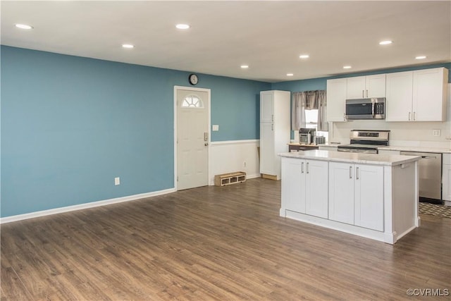 15601 Meridian Ave, Chester, VA 23831 - kitchen with appliances with stainless steel finishes, dark wood finished floors, light countertops, recessed lighting, and a kitchen island