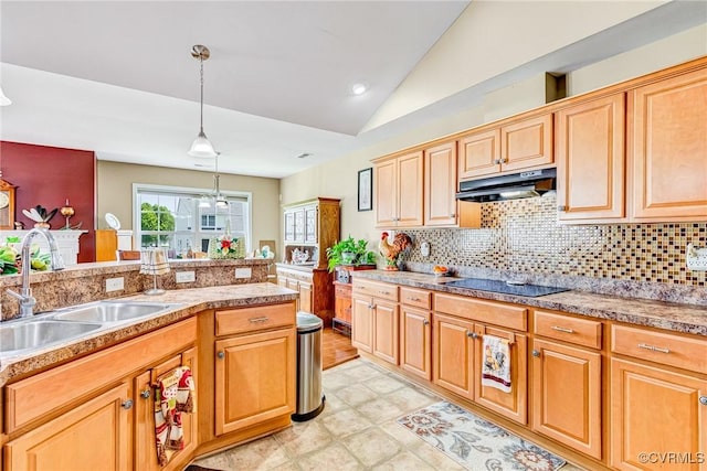 8125 Janice Ave, Mechanicsville, VA 23111 - kitchen with black electric cooktop, under cabinet range hood, vaulted ceiling, backsplash, and decorative light fixtures