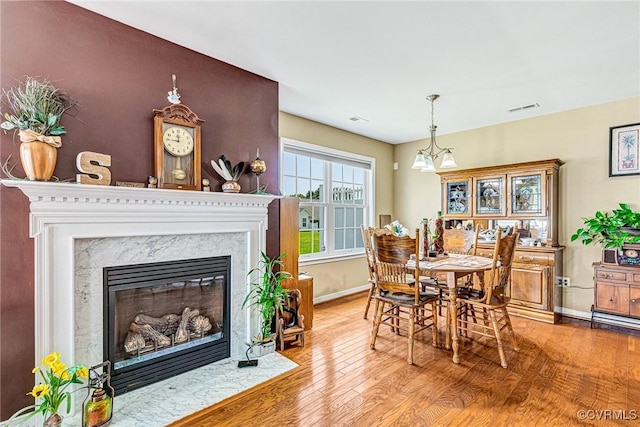 8125 Janice Ave, Mechanicsville, VA 23111 - dining area with wood finished floors and a premium fireplace