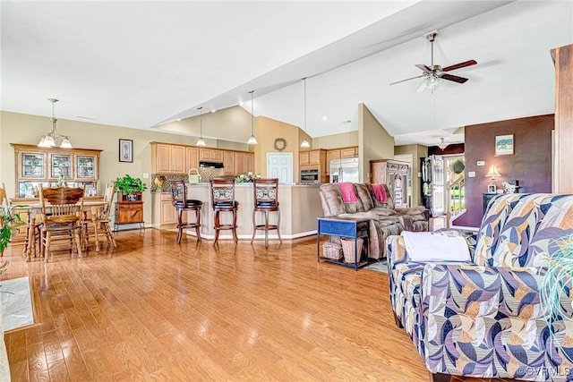 8125 Janice Ave, Mechanicsville, VA 23111 - living room featuring light wood-style floors, ceiling fan, and high vaulted ceiling