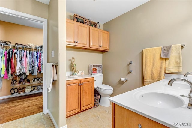 8125 Janice Ave, Mechanicsville, VA 23111 - full bath featuring double vanity, tile patterned flooring, and a walk in closet