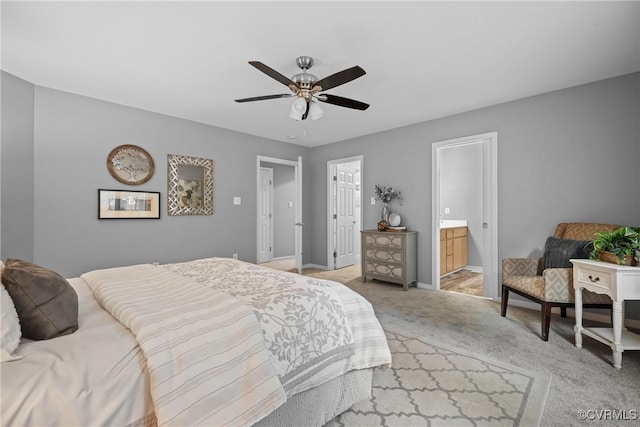 9712 Kingussle Ln, North Chesterfield, VA 23236 - bedroom with light colored carpet, ensuite bathroom, and a ceiling fan