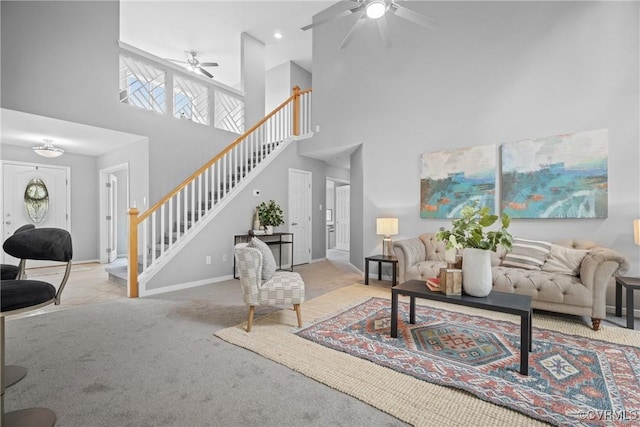 9712 Kingussle Ln, North Chesterfield, VA 23236 - living room featuring ceiling fan, stairway, carpet flooring, and a towering ceiling