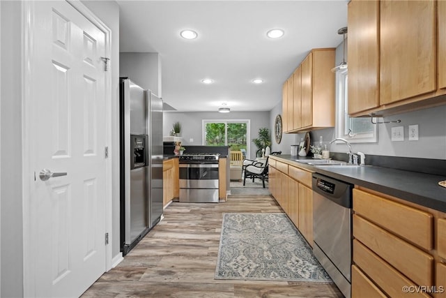 9712 Kingussle Ln, North Chesterfield, VA 23236 - kitchen with stainless steel appliances, dark countertops, light wood-style floors, recessed lighting, and light brown cabinets