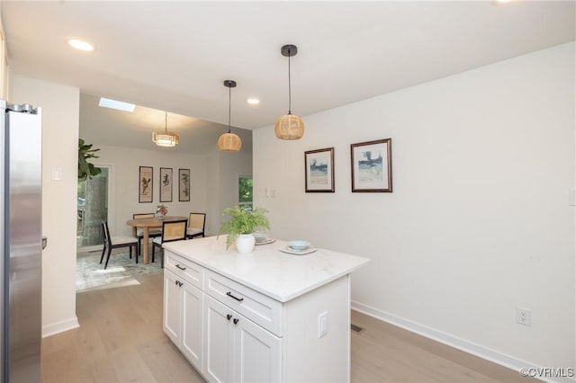 3211 Fox Chase Dr, Midlothian, VA 23112 - kitchen featuring stainless steel fridge, light wood-type flooring, recessed lighting, white cabinets, and a kitchen island