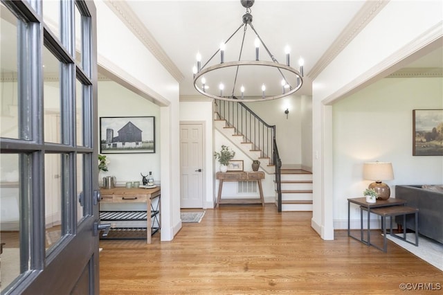 10703 Kriserin Cir, Chester, VA 23831 - foyer with a chandelier, stairs, light wood-style flooring, and ornamental molding
