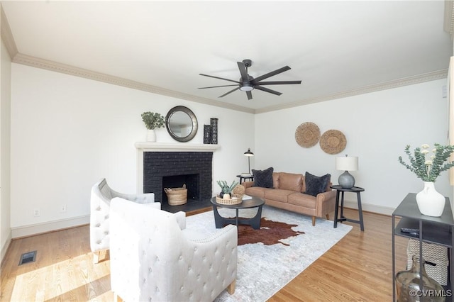 10703 Kriserin Cir, Chester, VA 23831 - living area with a ceiling fan, wood finished floors, crown molding, and a brick fireplace