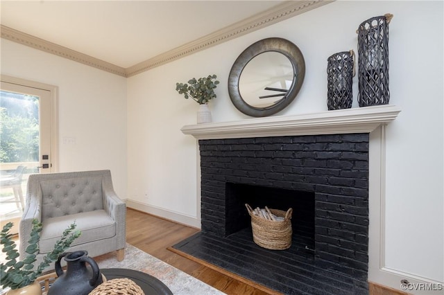 10703 Kriserin Cir, Chester, VA 23831 - living area with a brick fireplace, wood finished floors, and crown molding