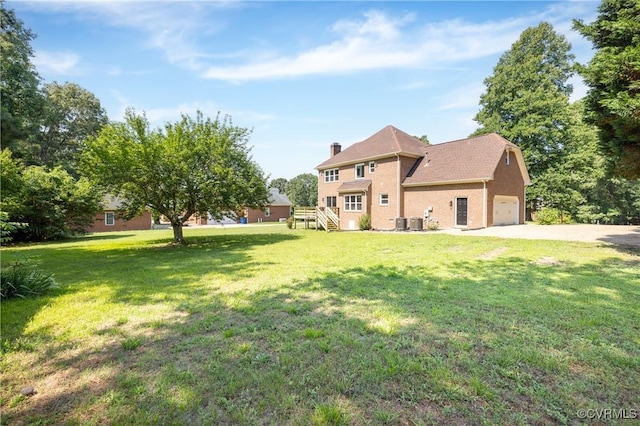 10703 Kriserin Cir, Chester, VA 23831 - back of property with a lawn, a chimney, and driveway