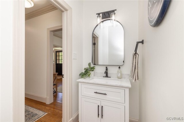 10703 Kriserin Cir, Chester, VA 23831 - bathroom featuring wood finished floors, vanity, and ornamental molding