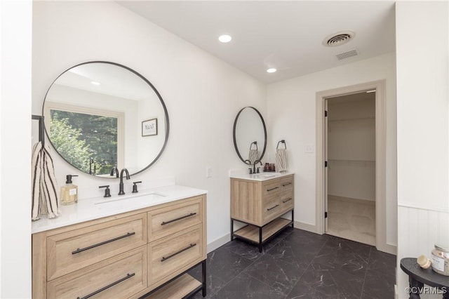 10703 Kriserin Cir, Chester, VA 23831 - bathroom featuring marble look tile flooring, two vanities, recessed lighting, and a walk in closet