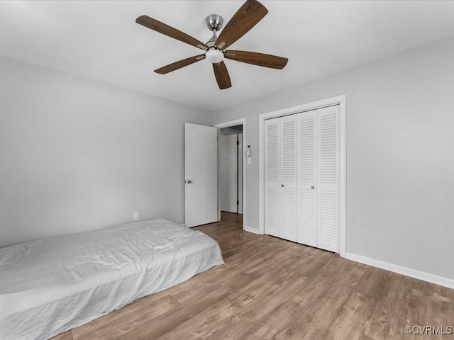 604 Smithfield Ave, Hopewell, VA 23860 - bedroom with wood finished floors, a closet, and ceiling fan
