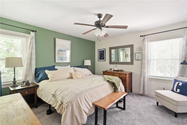 7085 Foxlair Dr, Mechanicsville, VA 23111 - bedroom with multiple windows, carpet flooring, and a ceiling fan