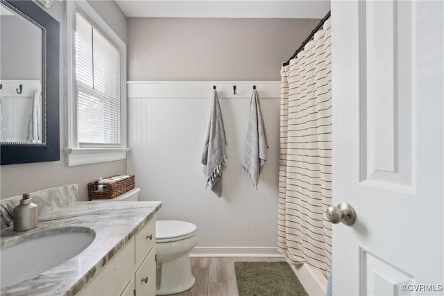 7085 Foxlair Dr, Mechanicsville, VA 23111 - bathroom with wood finished floors, vanity, and a shower with shower curtain