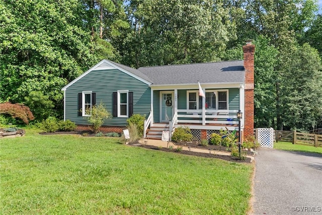 7085 Foxlair Dr, Mechanicsville, VA 23111 - view of front of property featuring covered porch and a chimney
