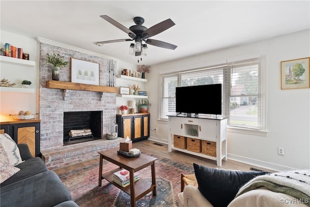 7085 Foxlair Dr, Mechanicsville, VA 23111 - living room with ceiling fan, a brick fireplace, and wood finished floors