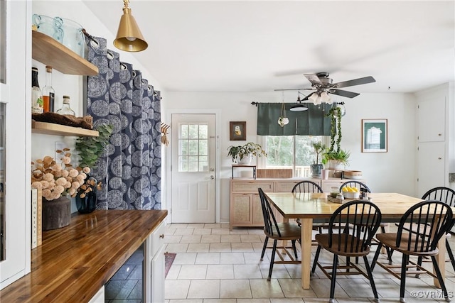7085 Foxlair Dr, Mechanicsville, VA 23111 - dining space with light tile patterned floors, a ceiling fan, and beverage cooler